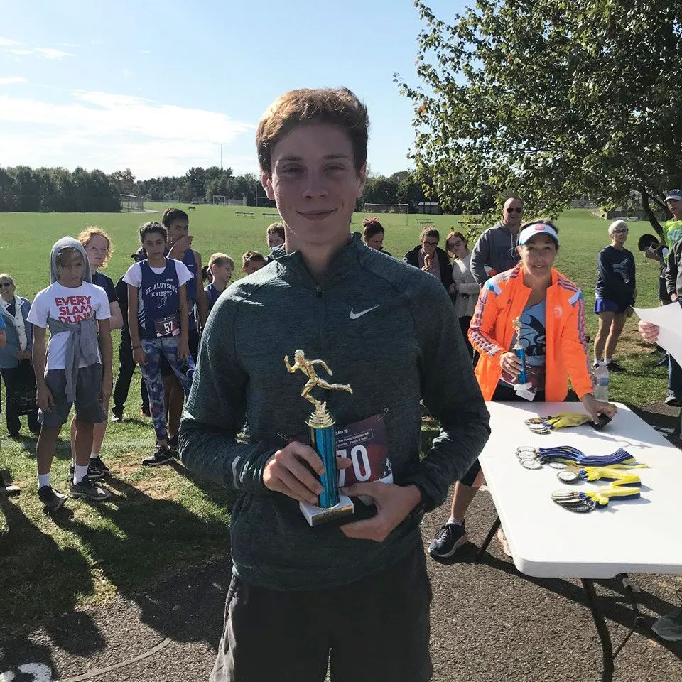 A man holding a trophy